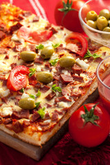 Pizza with tomato, salami and olives