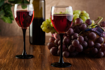 Glasses of red wine and bottle