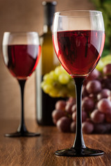 Glasses of red wine and bottle
