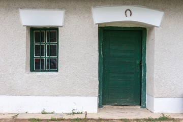 Fototapeta na wymiar Rural green door and window