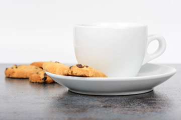 Fototapeta na wymiar Cup of coffee with cookies on table