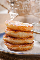 Cottage cheese pancakes sprinkled with powdered sugar