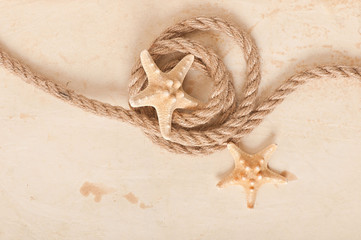 starfish and rope on old paper background