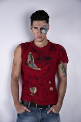 Attractive Young Man with Robotic Skin Art  and Ripped T-Shirt
