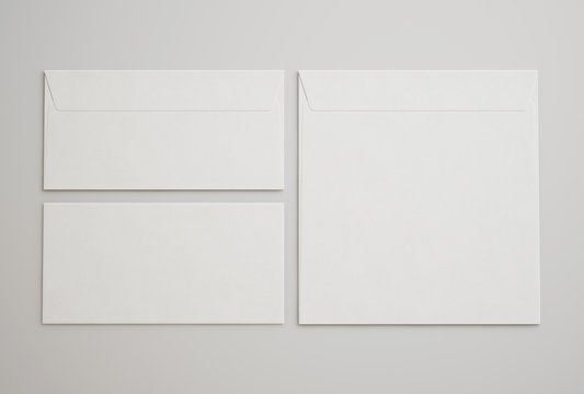 White envelopes on light gray background