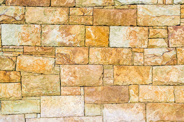 random stone background, old well maintained house