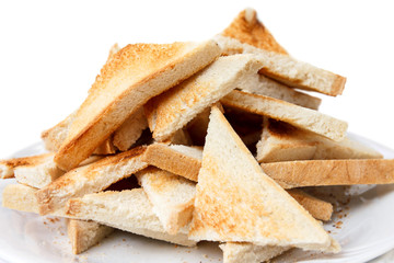 Pile of cut white toast, white background.