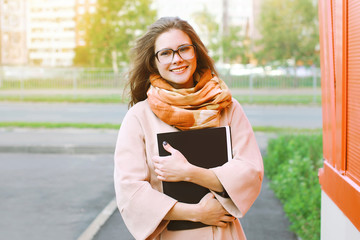 Education, student, autumn and people concept - happy smiling gi