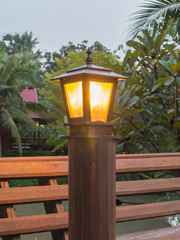 Lit lamp post at the garden