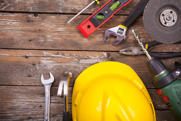 Set of tools over a wooden background