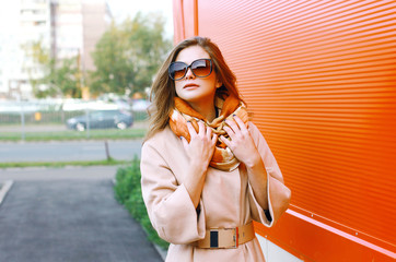 Fototapeta premium Pretty sensual woman in coat posing in the city, street fashion