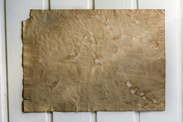 old paper, white wood background