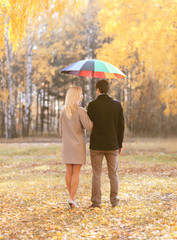 Autumn, love, relationships and people concept - young couple in
