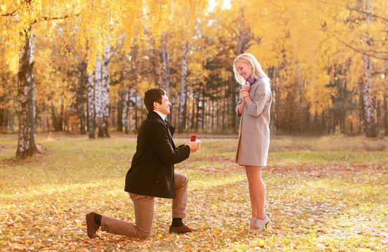 Love, couple, relationship and engagement concept - kneeled man