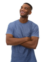 Attractive young black man smiling with arms crossed