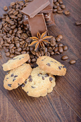 Fototapeta na wymiar Cookies, coffee beans, anise and chocolate