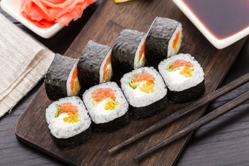 Sushi rolls with salmon and vegetables
