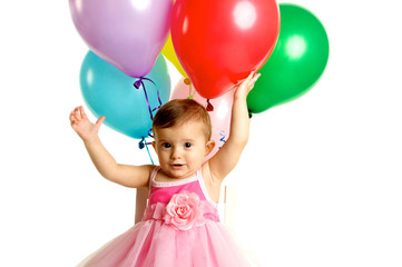 Fototapeta na wymiar Cute One Year Baby Girl with Birthday Balloons