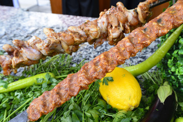 Raw meat on skewers of vegetables
