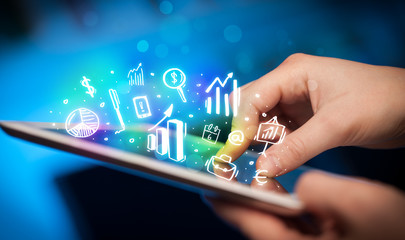 Hand touching tablet pc, charts concept