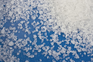 Close-up shot of a sugar on blue background