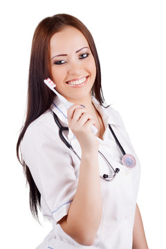 Woman doctor with toothbrush in hand