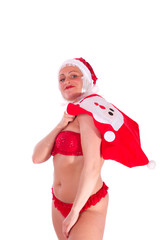 Weihnachtsfrau mit Geschenksack über der Schulter - isoliert