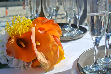 Wedding bouquet on the table with glasses