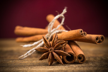 Close up of cinnamon sticks and star anise on wood