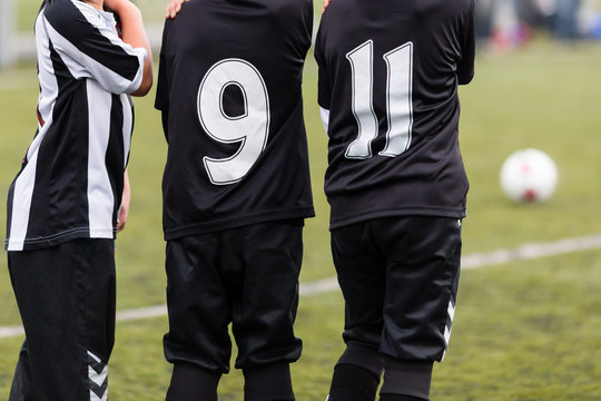 Soccer boys defending their goal