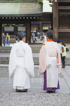 Shinto priests at the Meiji Shrine in Tokyo, Japan.