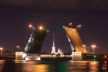 Fototapeta na wymiar Open drawbridge at night in St. Petersburg Russia