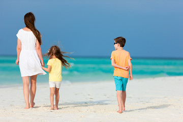 Mother and kids on a tropical beach