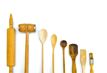 row of wooden kitchen utensils