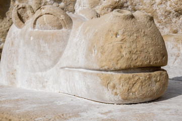 Hippo sculpture from stone on Red Beach near Matala
