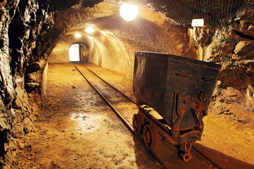 Underground train in mine, carts in gold, silver and copper mine