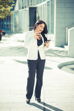 beautiful long black hair elegant business woman using smartphon