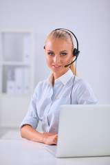 Portrait of beautiful businesswoman working at her desk with