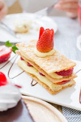 Mille feuille, puff pastry layered with strawberries and whipped