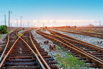 Fototapeta premium Cargo train platform at sunset with container