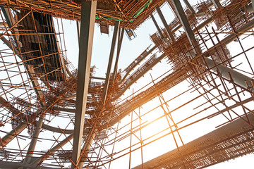 Silhouettes of scaffolding on sunset