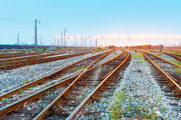 Cargo train platform at sunset with container