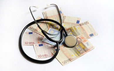 banknotes and stethoscope