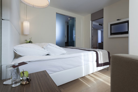 Interior of a luxury hotel bedroom with bathroom 