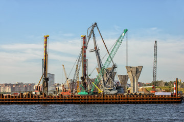 Obraz premium Construction of a bridge over the river
