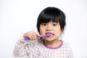 Child brushing teeth