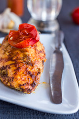 chicken fillet baked in spices and tomatoes, vegetables