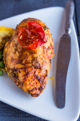 chicken fillet baked in spices and tomatoes, vegetables