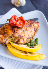 chicken fillet baked in spices and tomatoes, vegetables