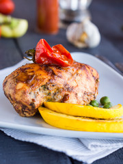 Baked chicken in a spicy sauce with vegetables